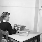Blind & Deaf Institute, visually-impaired boy writing on a Braille typewriter, 1951 to 1973